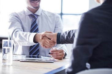 two business people shaking hands
