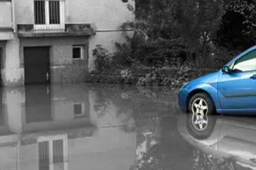 Car drives into standing water