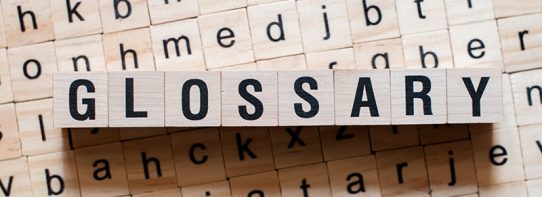Letter tiles spelling out the word Glossary