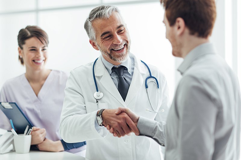 Doctor shaking hands with patient