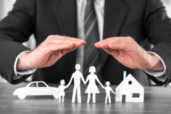 man holding hands over family cutout