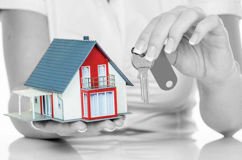 woman holding house and keys