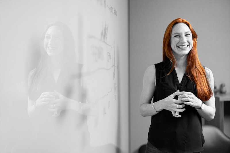 woman in front of whiteboard