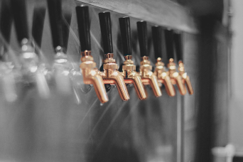 bronze taps at a brewery