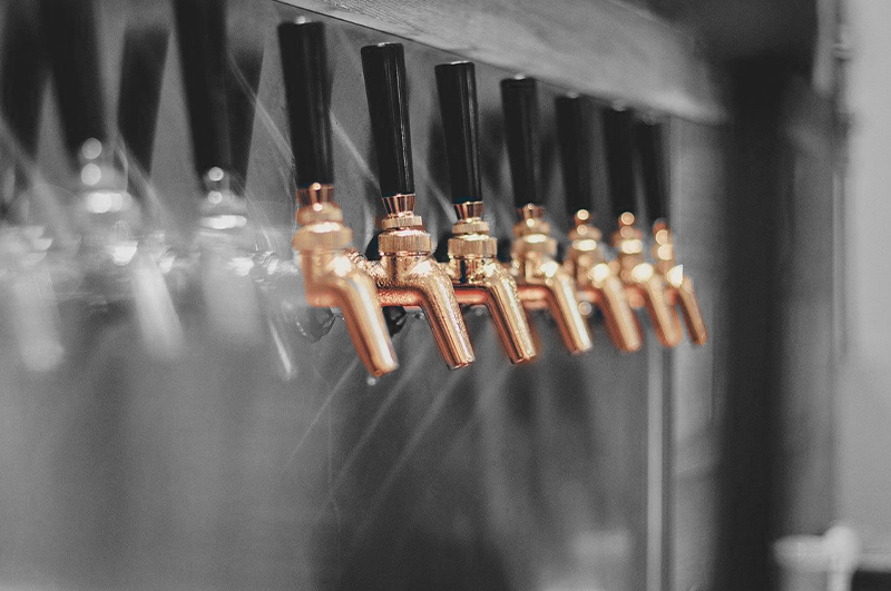 bronze taps at a brewery
