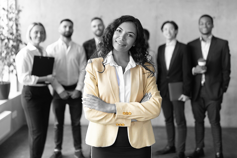 saleswoman standing in front of colleagues