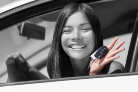 woman holding car keys